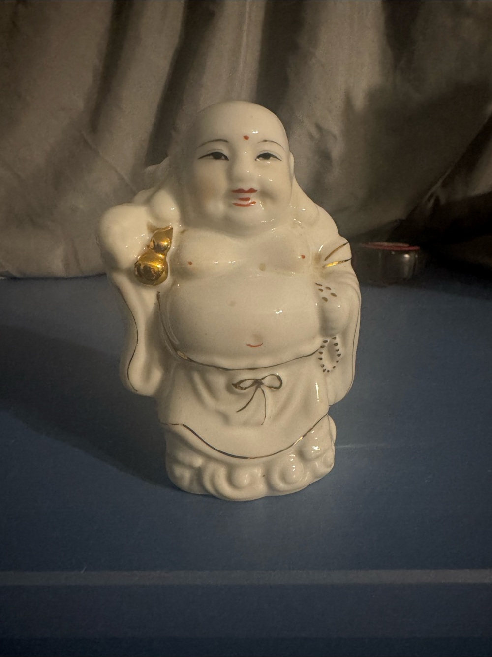 White Ceramic Laughing Buddha Figurine with Gold Accents